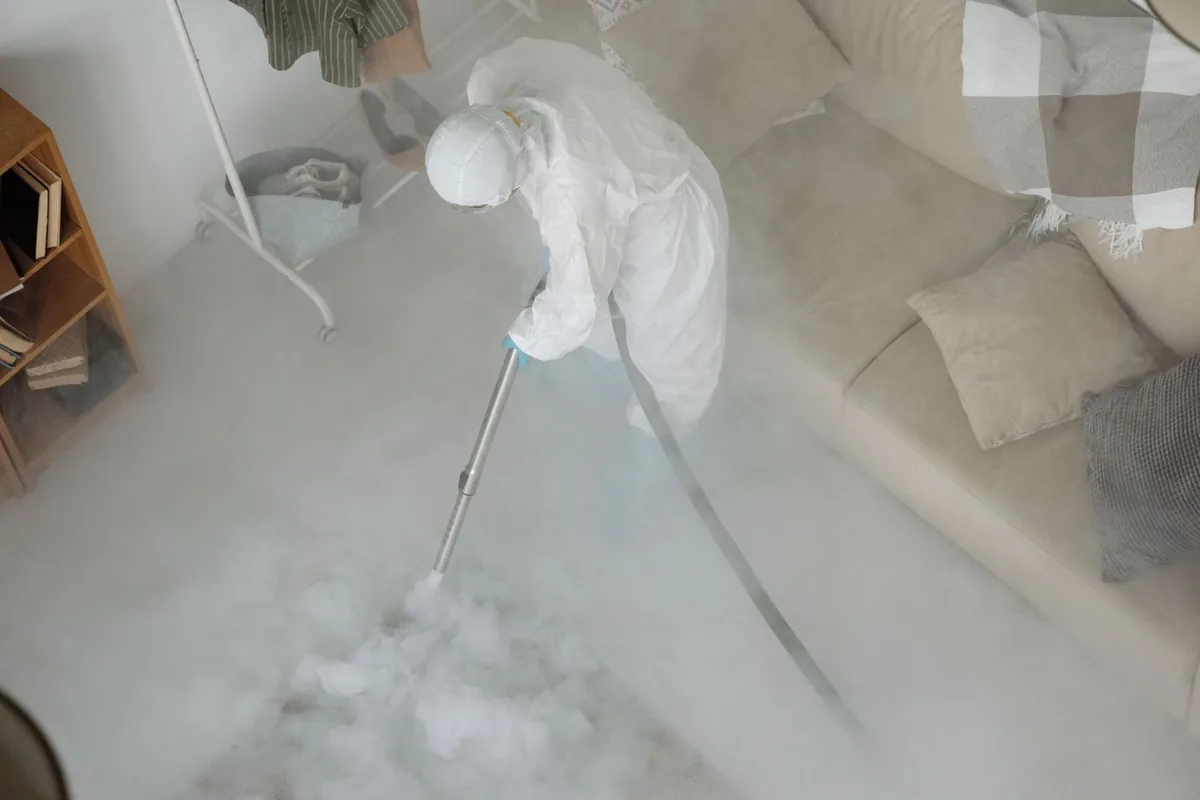 Biohazard cleanup technician in protective equipment, Harlem, GA